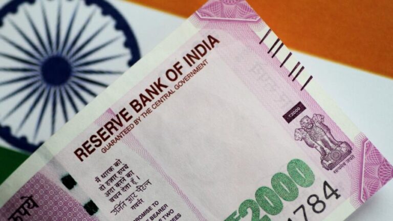 Indian rupee ticks higher on likely RBI intervention, traders eye equity flows