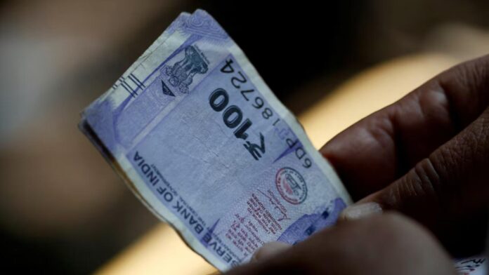 Indian rupee drops to lifetime low on outflow worries