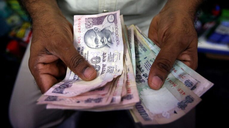 Indian rupee slips but state-run banks' dollar sales cap losses