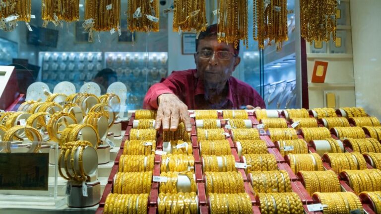 Gold regains ground on dollar's retreat as markets await Fed rate decision